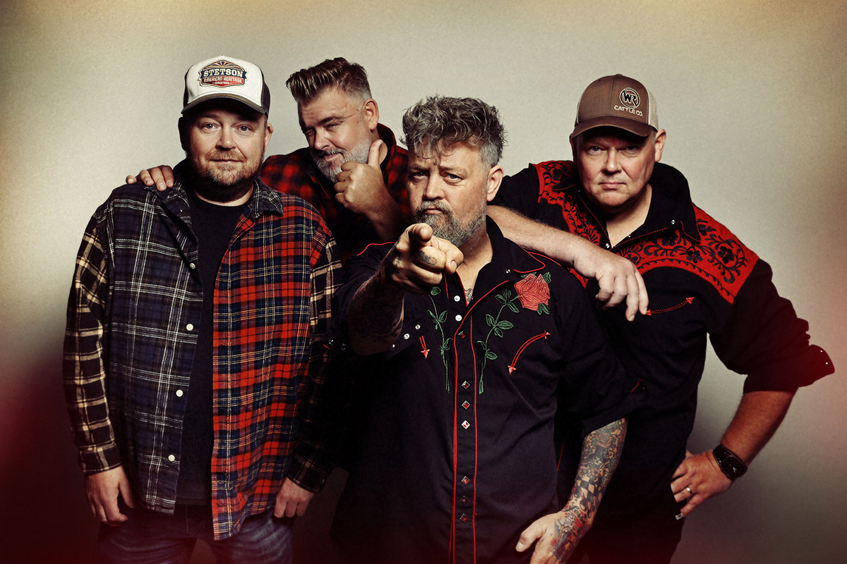 Mannen van de band mooi wark kijken camera in